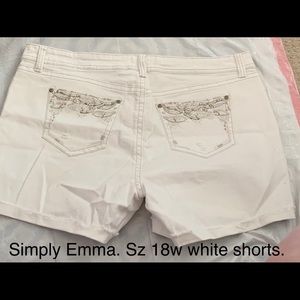 White shorts. Design on pockets